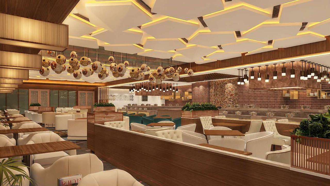 Отель Radisson Blu Towers Kaushambi Delhi Ncr Газиабад Экстерьер фото Interior of a restaurant
